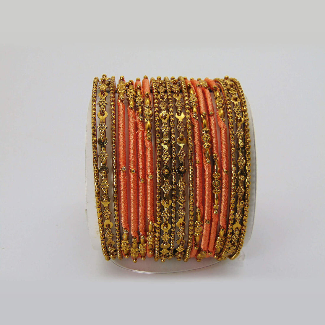 Beautiful Silky Threaded Peachy Colored Bangles