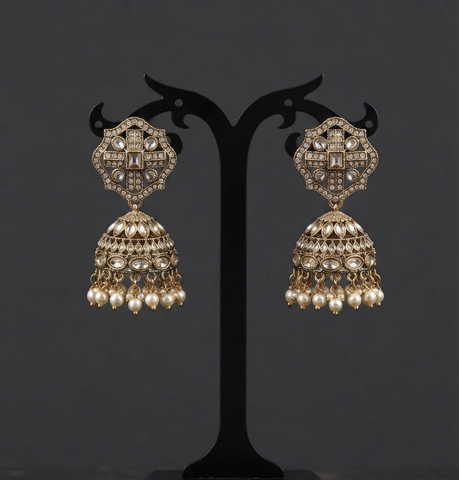 Antique-Finish Kundan Jhumka Earrings With Pearl Drops.