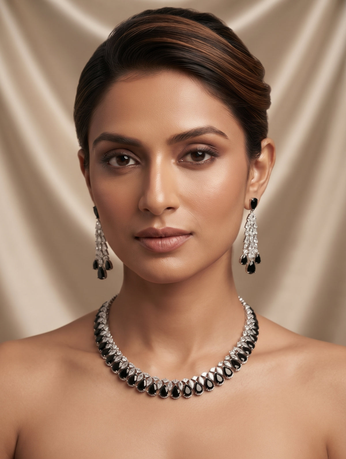 Stylish rhodium plated necklace and earring set adorned with sparkling black CZ crystals.