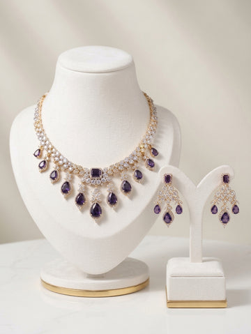 Gold and rhodium-plated necklace set with purple crystals and CZ earrings.