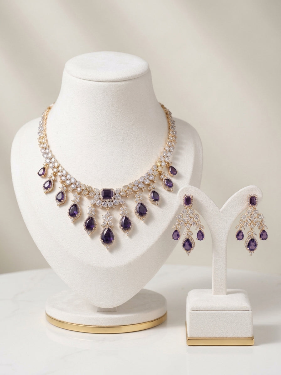 Gold and rhodium-plated necklace set with purple crystals and CZ earrings.