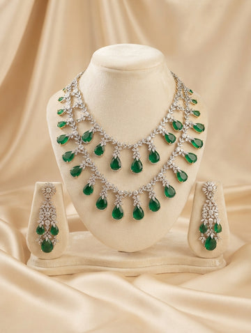 Elegant rhodium contemporary necklace and earring set featuring dazzling CZ crystals with Emerald Green crystals