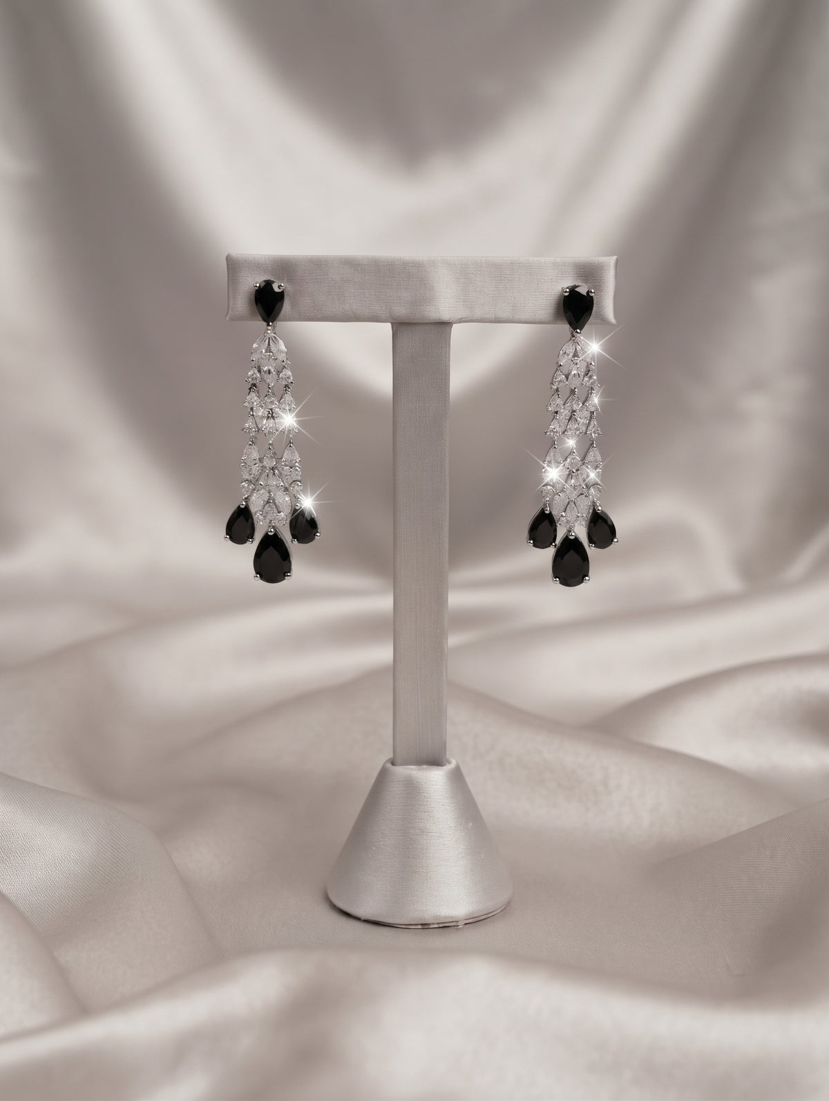 Stylish rhodium plated necklace and earring set adorned with sparkling black CZ crystals.