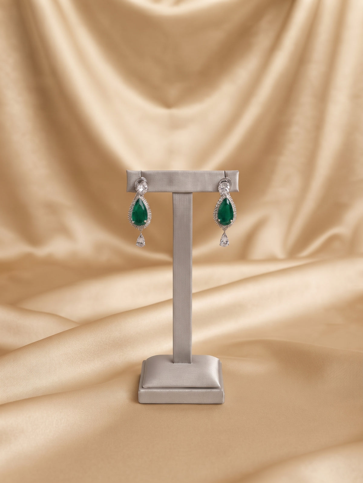 Stylish rhodium plated necklace and earring set adorned with sparkling emerald, green CZ crystals.