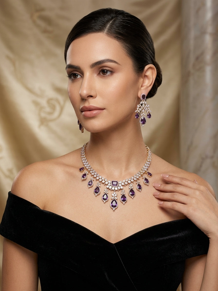 Gold and rhodium-plated necklace set with purple crystals and CZ earrings.