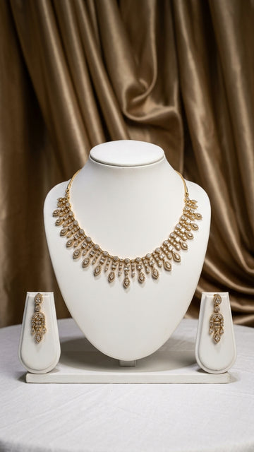 Antique gold necklace and earring set adorned with sparkling CZ stones