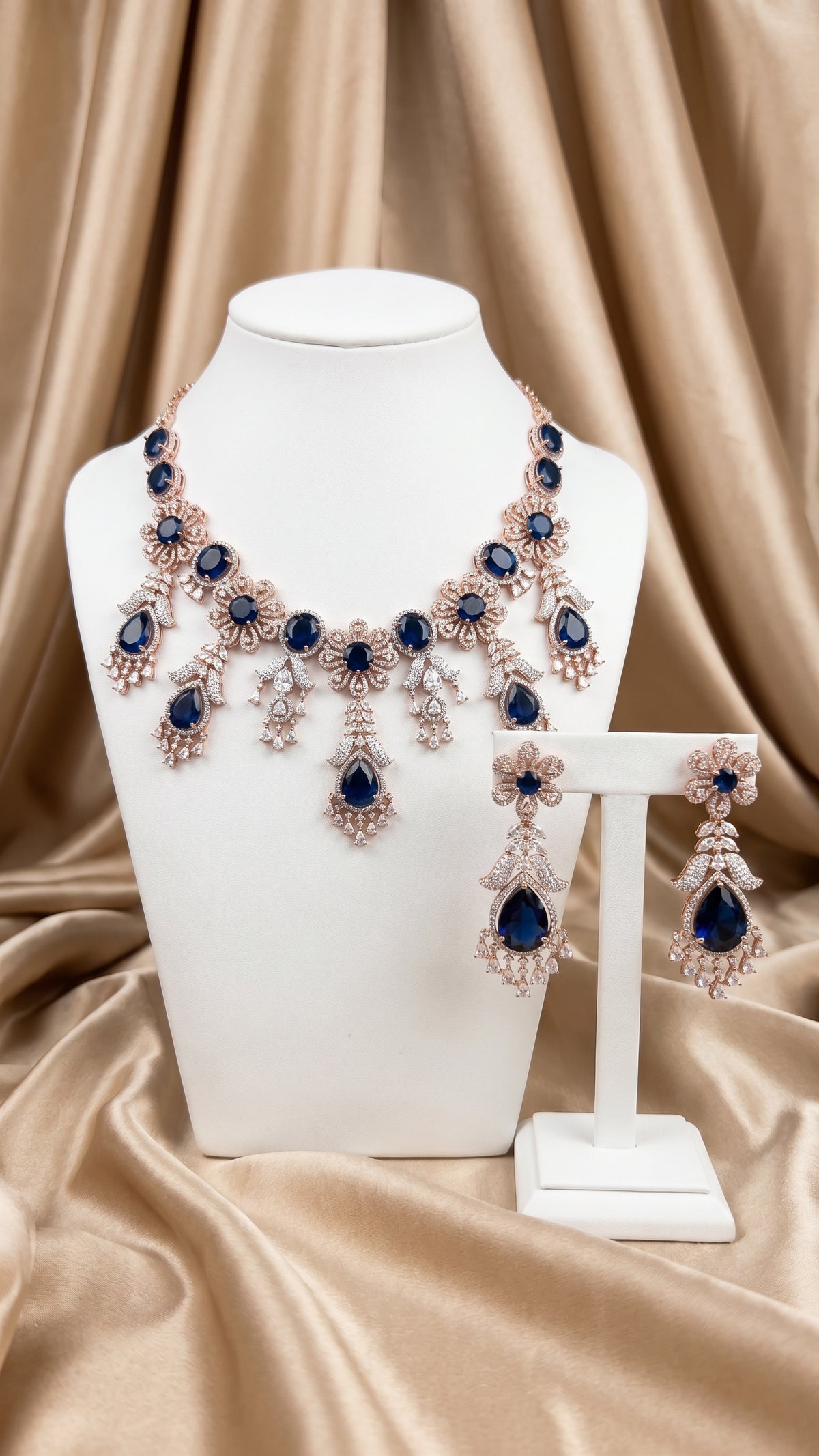 Rose gold plated necklace earring set with blue cubic zirconia crystals