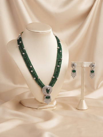 CZ crystal-embellished long rhodium-plated jewelry set with green emerald crystals