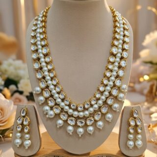 Elegant designer Kundan necklace and earring set.