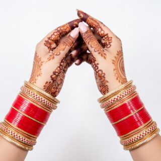 Traditional Red Bridal Bangles with Intricate Carvings