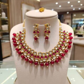 Elegant designer Kundan necklace and earring set.