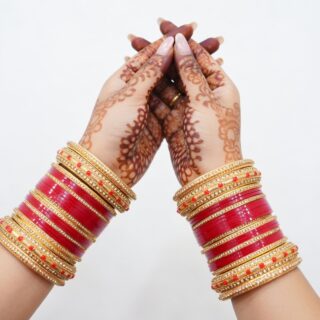 Traditional Red Bridal Bangles with Intricate Carvings
