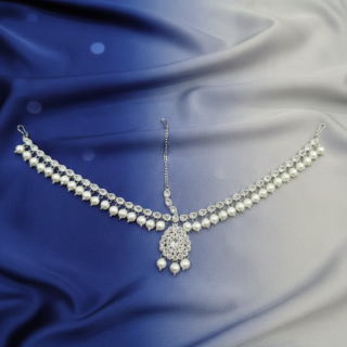 An exquisite CZ-encrusted Matha Patti, beautifully accented with luminous pearls and delicate beadwork.