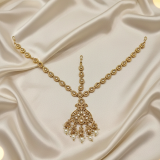 An exquisite CZ-encrusted Matha Patti, beautifully accented with luminous pearls and delicate beadwork.