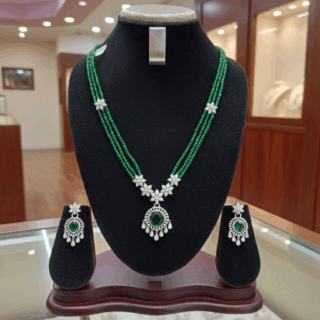 CZ crystal-embellished long rhodium-plated jewelry set with green emerald crystals
