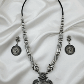 Radiant Festive Style: Oxidized Silver Necklace & Earring Set