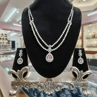 CZ crystal-embellished long rhodium-plated jewelry set with pink crystal.