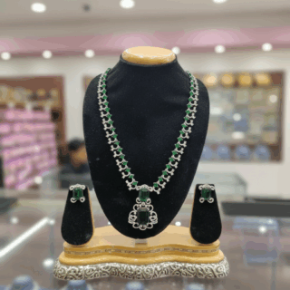 CZ crystal-embellished long rhodium-plated jewelry set with emerald green crystals