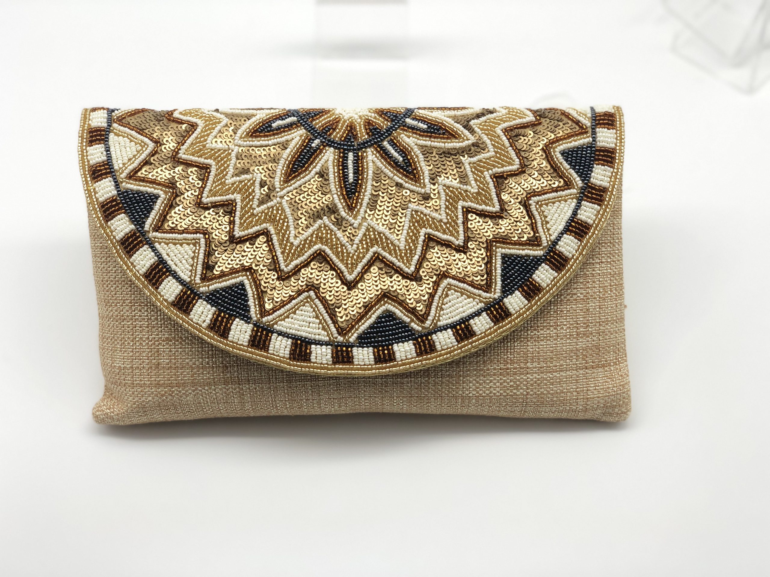 Fancy Party clutches and evening bags with hand embroidered on Silk/Jute  material.