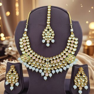 Elegant designer Kundan necklace and earring set.