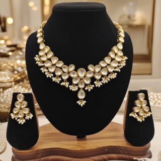 Elegant designer Kundan necklace and earring set.