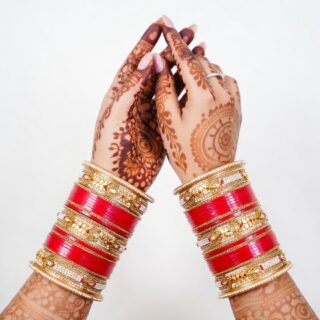 Traditional Red Bridal Bangles with Intricate Carvings