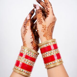 Traditional Red Bridal Bangles with Intricate Carvings
